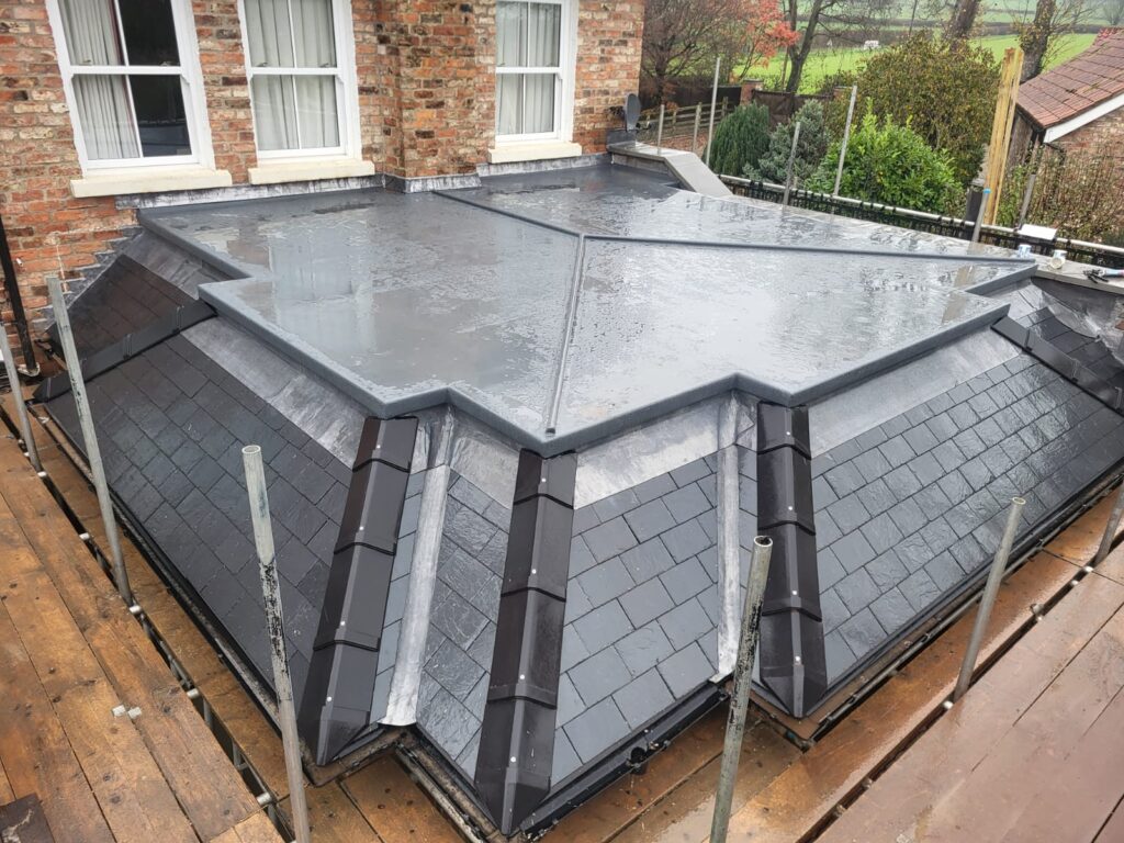 gray GRP flat roof with slate tile